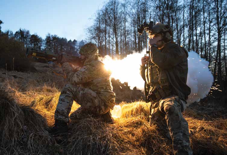 A Romanian Special Forces Soldier fires an AT4 rocket launcher simulator at enemy tanks while a U.S. Air Force JTAC calls in their location during Combined Resolve 15 at Hohenfels training area on February 26, 2021. Joint Terminal Attack Controllers (JTAC) play a key role in providing a link between air assets and personnel on the ground. (U.S Army photo by Sgt Patrik Orcutt)